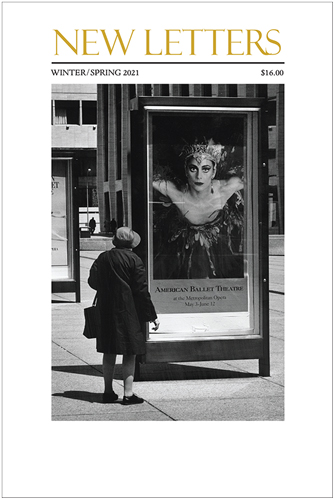 woman looking at a poster for a ballet performance