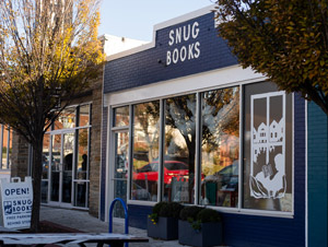 Storefront photograph of indie bookstore Snug Books located in Baltimore, Maryland
