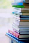 Picture of a stack of books; photo by Alexander Grey via Pexels